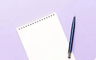 Bi-weekly check-in cover: notepad and pen on lilac