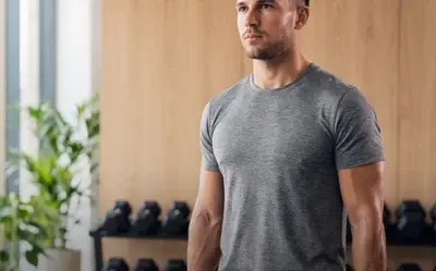 Gym workout cover: a man holding dumbbells