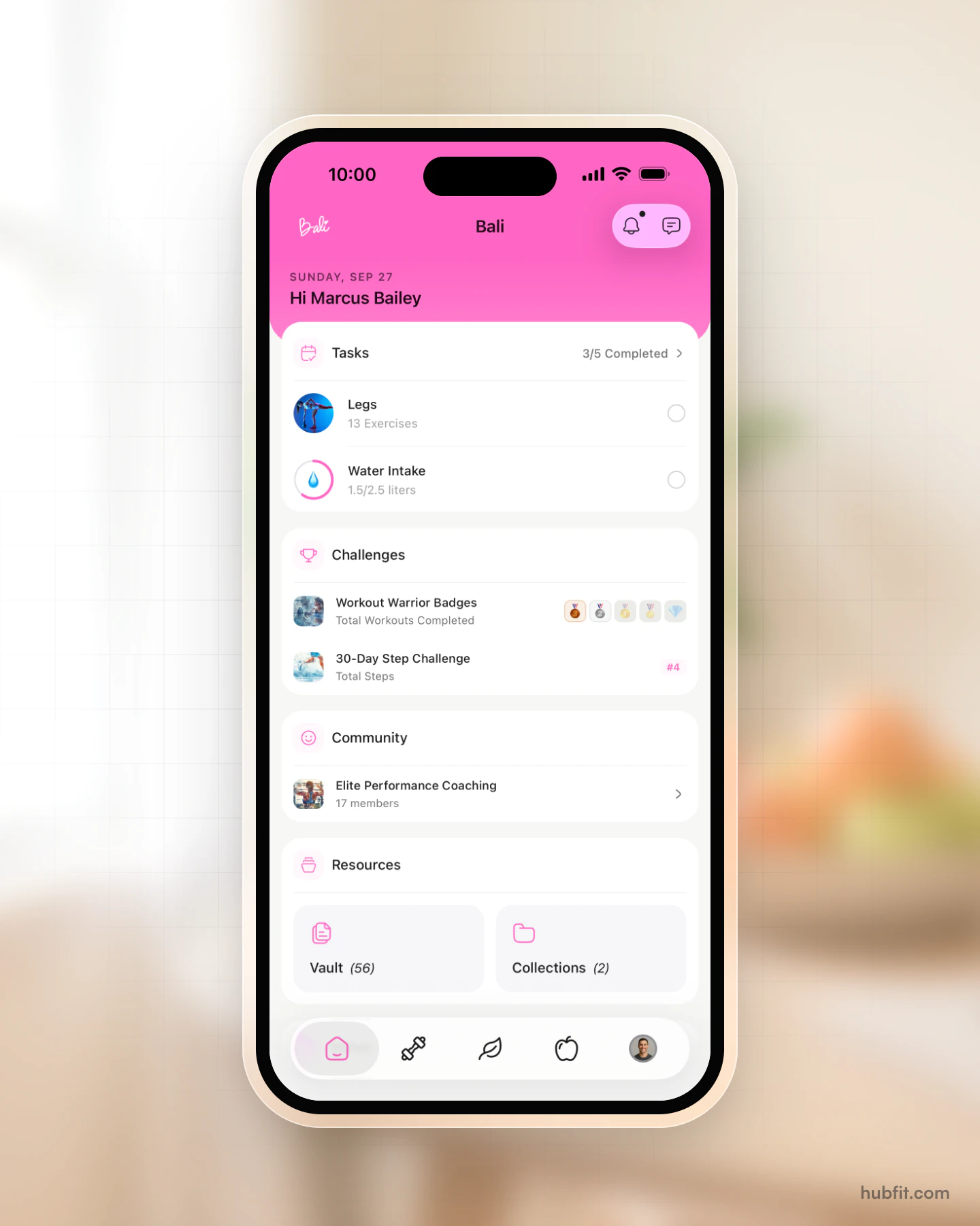 Example branded app: the client home screen as Bali, in its own pink with its own logo, showing today's tasks, challenges, a community and resources